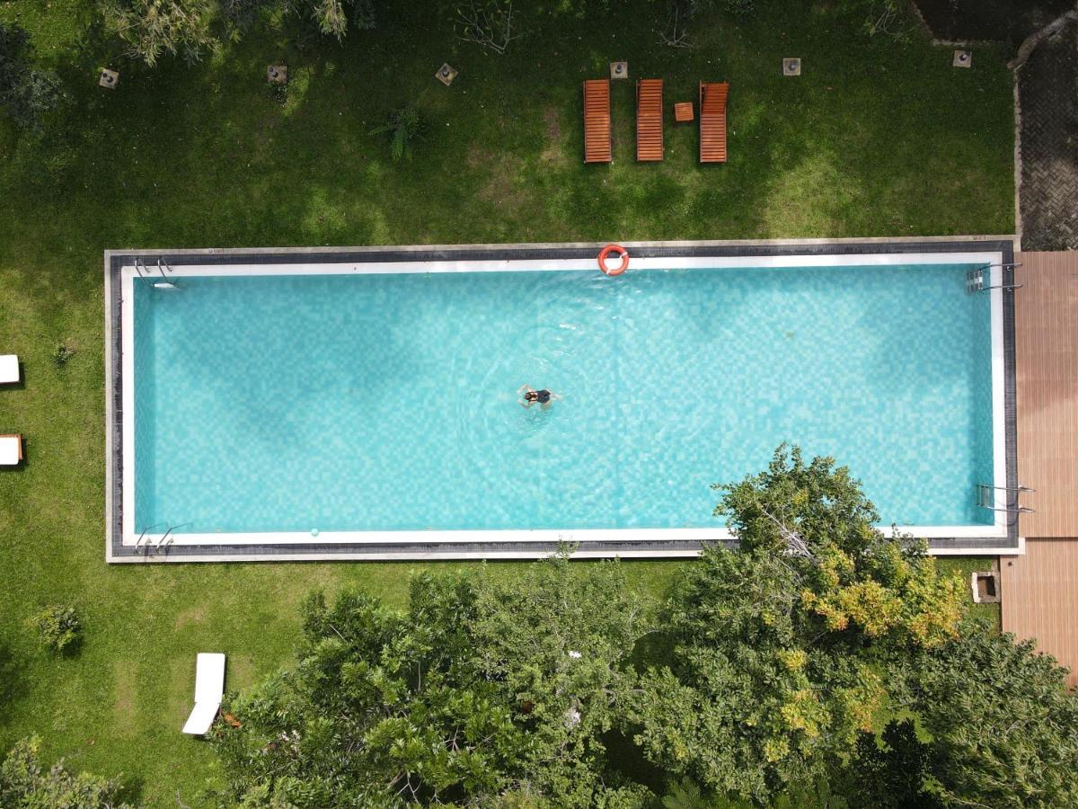 Nivadoo Resort Сігірія Екстер'єр фото Aerial view of a swimming pool