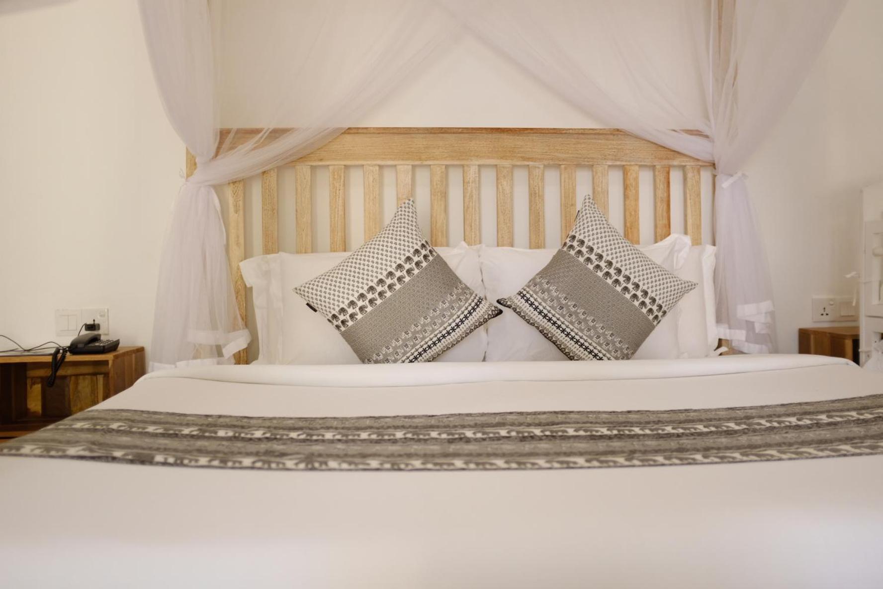 Nivadoo Resort Сігірія Номер фото A bed with a mosquito net